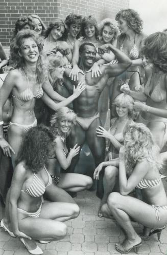 Beauties and the body-builder, Contestants for the Miss Chin Bikini pageant at the 7th annual Chin-Molson picnic, to be held at Exhibition Place June (...)