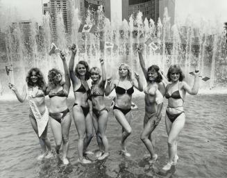 Fountain of beauty, Miss Bikini of Ontario pageant contestants cool of in the fountain at Nathan Phillips Square