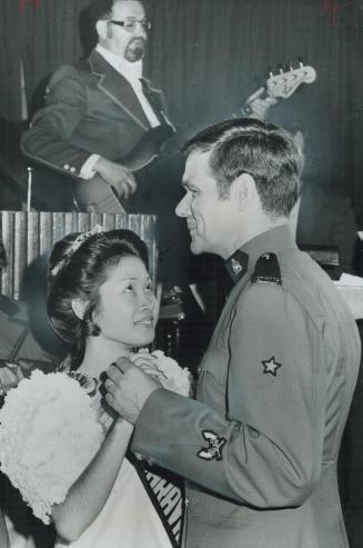 Miss Manila-Martha Jane Roa-Yu, 24-dances last night with RCMP Constable Jack Snoeks in the Royal York after she was crowned Miss Caravan. Her prize i(...)