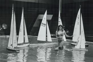 Brenda Hughes, Miss Boatshow '81, caused a big splash in the Coliseum pool during radio-controlled sailboat races