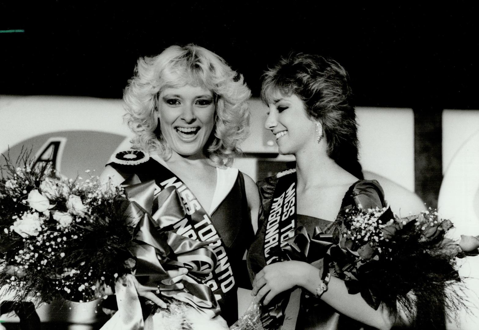 Here she comes . . . It's Miss Argggooo!, Astrid Hildebrandt, 22, left, is obviously delighted with her title of Miss Toronto Argonaut Football Club 1(...)