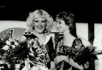 Here she comes . . . It's Miss Argggooo!, Astrid Hildebrandt, 22, left, is obviously delighted with her title of Miss Toronto Argonaut Football Club 1(...)