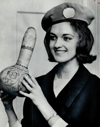 Linda Dumas, Miss Canada, wears a United Nations beret on her return from Cyprus