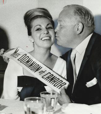 At civic reception for Miss Universe at the We hotel,Controller Allan Lamport gives Mary Lou F a warm welcome