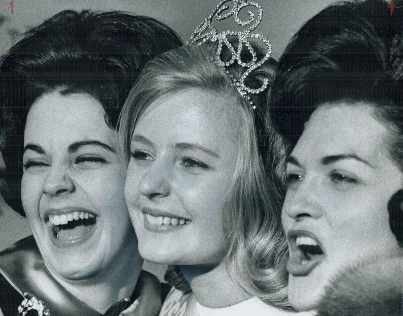Bliss! Miss Ottawa Rough Rider, 17-year-old Renata Pikelis ( prised and delighted young lady after winning the Miss last night. Noreen Shick (left) and Jacqueline Kramer [Incomplete]