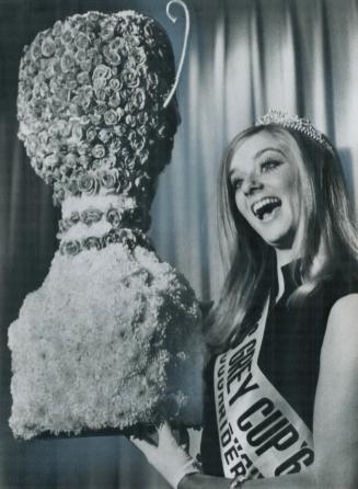 Her smile lit up the room yesterday when Laura Wedland, 19, Miss Saskatchewan Roughrider, was named Miss Grey Cup in Montreal. The blonde University o(...)