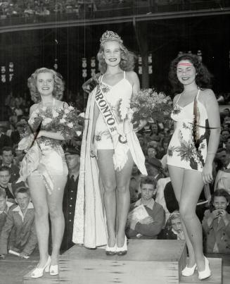Crowned Miss Toronto of 1947. Margaret Marshall, 18, a blonde theatre cashier, seen here