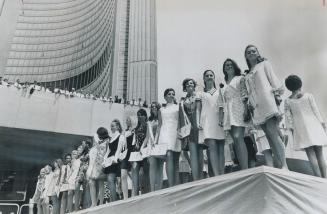 Toronto's girl watchers had a field day yesterday as 40 miniskirted lovelies, finalists in the Miss Toronto contest, rode up Bay St. in convertibles t(...)