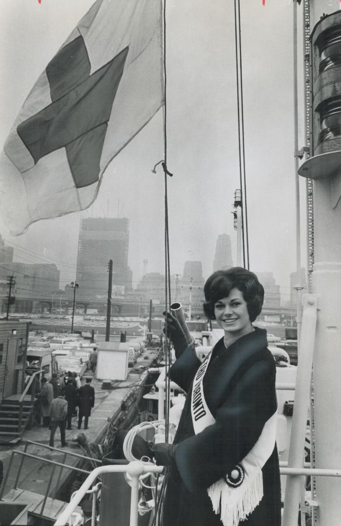 Blood for Red Cross, Firefighters kicked off annual two week blood donor drive yesterday when Marlene Lincoln, Miss Metro Toronto, raised the Red Cross flag on the city's fireboat