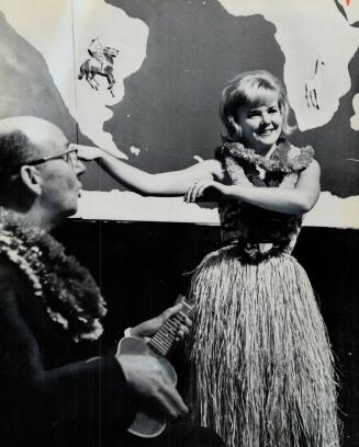 Hawaiian Appeal, Miss United Appeal, Marion Wright, 18, tries Hawaiian dancing to the playing of campaign chairman John D. King at the first report lu(...)