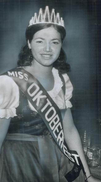 Miss Oktoberfest, Queen of Metro's three-day Oktoberfest, a festival of beer and gaiety at the CNE Coliseum sponsored by two Metro German clubs, is Su(...)