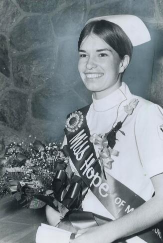 Nancy Hillier, a 20-year-old student at Wellesley Hospital school of nursing, was chosen Miss Hope at a Canadian Cancer Society dinner last night at I(...)