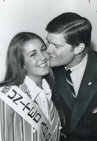 Miss United Appeal, 17-year-old Kerry Rubinstein, a Grade 12 student at Bathurst Heights Secondary School, gets a kiss from J. C. Thackray, 1971 Unite(...)