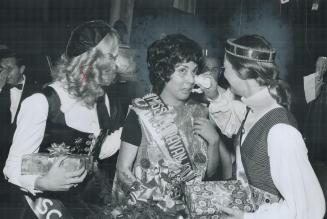 Miss Caravan, 19-year-old Jennifer Khan of the Port Royal pavilion, starts to cry on winning the title last night at a dinner-dance in the Royal York (...)