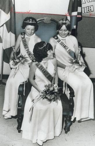 Orangemen choose a queen, Junior Orange Queen of Toronto, chosen yesterday, is 14-year-old Carole Anne Hayes, seated with her princesses behind her