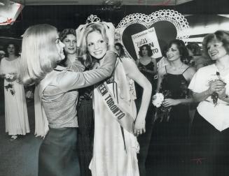 Queen Carolyn (Cali) Timmins, 14, is crowned Miss Teen Toronto by last year's winner, Dawn Lemieux