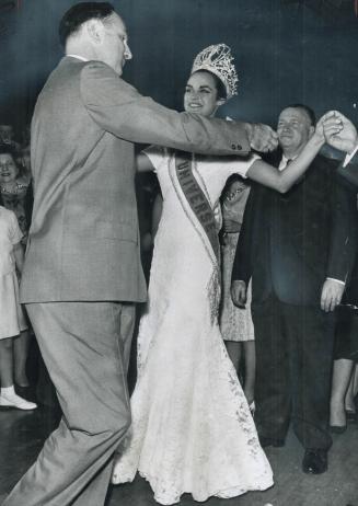 Miss Universe, 20-year-old Kiriaki Tsopei of Athens, dances the Kalamatiano with Mike Plumides of Charlotte, N
