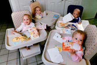Checking over their first birthday cards yesterday are the Stirk quadruplets, from left, Margaret, Jennifer, Iain and Anne. Averaging just 2.7 pounds (...)