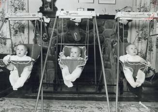 For 12 minutes the triplets, from left to right, Elizabeth, Christian and Erin won't need parents' attention