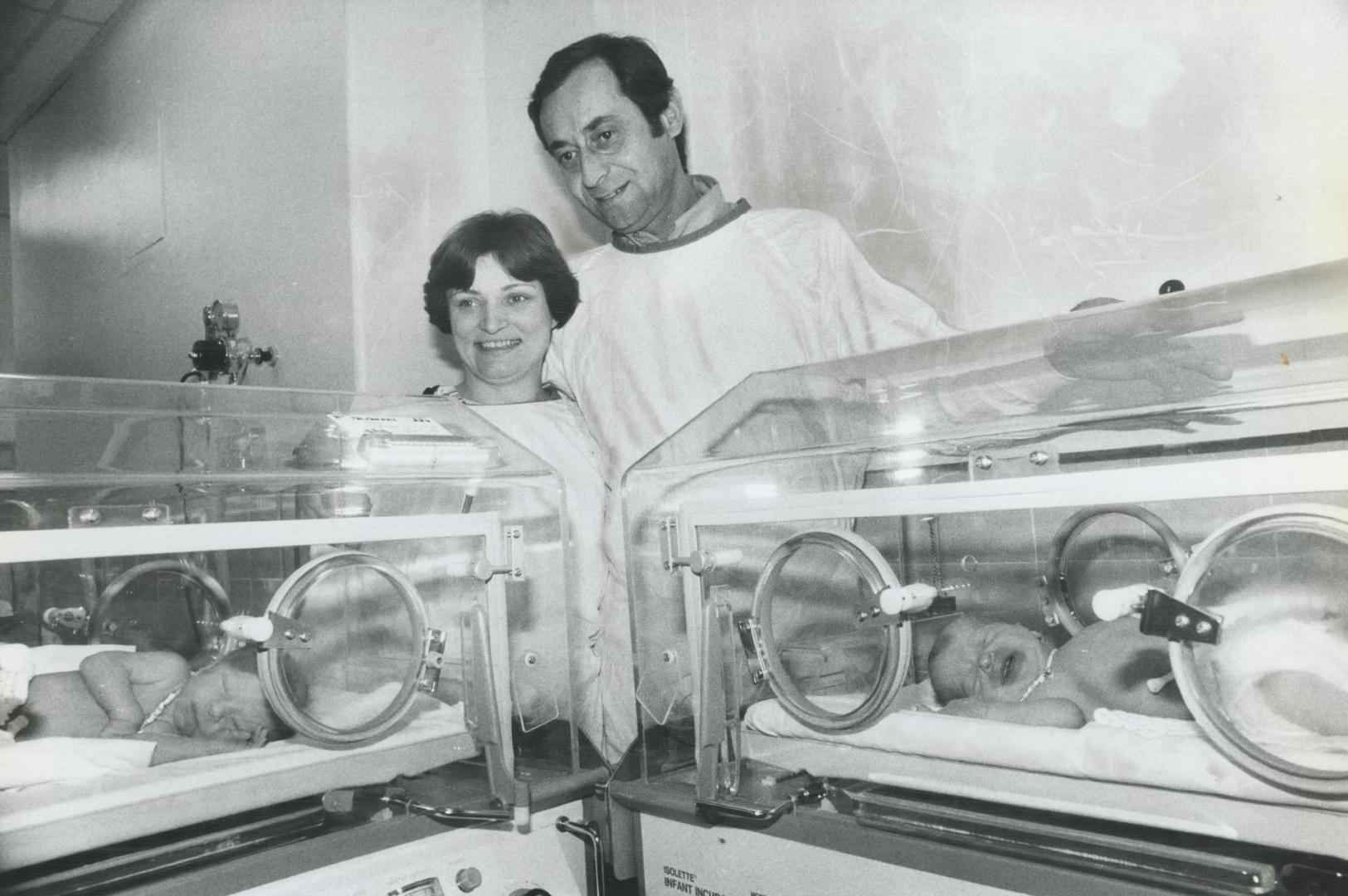 Proud parents: This photo of Mileva and Ranko Trifunovic, looking at their newly-arrived sons in their Scarboro General Hospital incubators, appeared in The Toronto Star 10 years ago