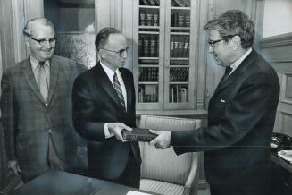 The newest NDP member is sworn in, New Democratic Party Leader Donald MacDonald looks on as Archdeacon Kenneth C