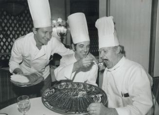 Debro Hrana! That's Yugoslav for good food - and it captures the sentiment in this photo as Royal York executive chef Silvano Krisic (centre) administ(...)