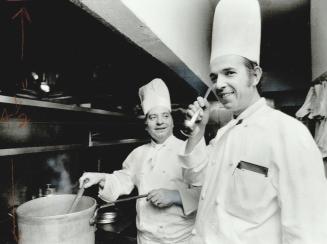 Working together: Executive sous chef Snvano Kirisic (far right), who will take over from Didier in April, tastes sauce while Dominic Sousa is busy stirring