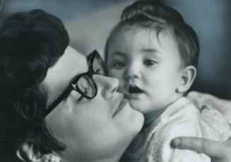 Mrs. Alex Poirier holds the baby she's named Mary-Anne and who was left with her as an infant last July. Now Mrs. Poirier is searching for the baby's (...)