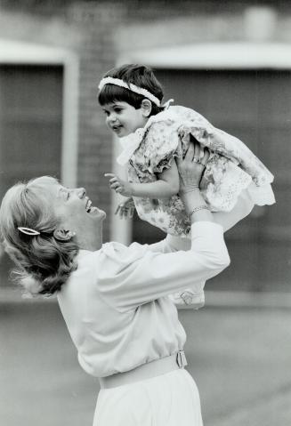 Grandmother's Dream: June Manning of Etobicoke plays with Alexandra, a 21-month-old Romanian orphan adopted by her daughter