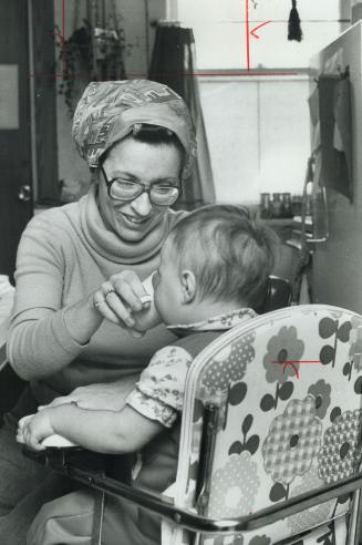 Mary Ellen Stinson feeds 15-month-old Nancy
