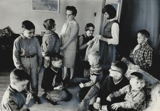 I Love Them All, says Mrs. James Bell of Torrance Rd., Scarboro, as she readies 10 foster children for school. With her here are June, 14, Andy, 12, D(...)