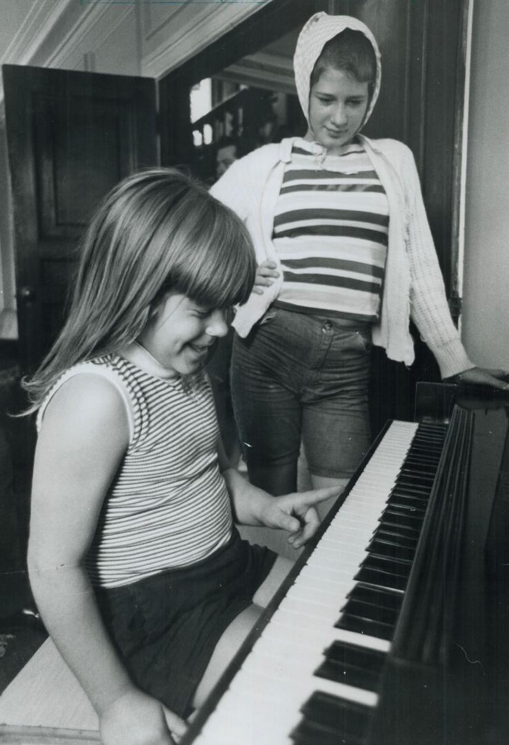 Two 'Regulars' enjoy the piano in oak ridges centre, Brown's system is to recreate the family atmosphere for the children