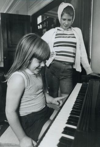Two 'Regulars' enjoy the piano in oak ridges centre, Brown's system is to recreate the family atmosphere for the children