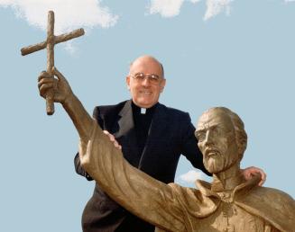Proud Moment: Rev. Bernard Canning shows off statue of St. Isaac Jogues, by sulptor Giovanni Fanton, outside St. Issac Jogues church in Pickering. Jog(...)