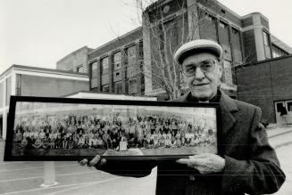 Back to time: Rev. Douglas Crocker holds a photo of students attending Earl Haig Collegiate in 1930. About 4,000 to 5,000 former students are expected(...)