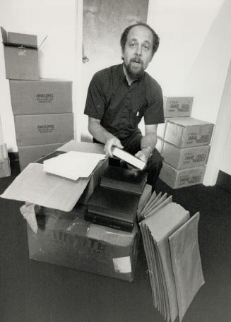Boxes of books: Father Taras Dusanowsklj packs prayer books and Bibles for Catholics in the western Ukraine