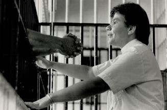 Solace in cells: Rev. Sylvia Dunstan, a United Church minister, shares a moment of prayer with an inmate at Whitby Jail. As chaplain to the 2,000 who (...)