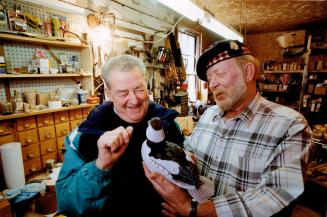 Rev. Doug Hall, right, former police officer and now church minister, shows off duck - winner at last weekend's Roseneath carvers competition - to Fra(...)