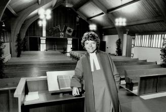 Ready to serve: Rev. Carolyn Holland stands by pulpit of York Pines United Church in Kettleby. The former high school dropout gave up on religion as a(...)
