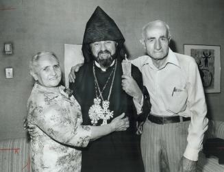 Proud parents Ovsanna and Hagop Sarkissian hug their son, His Holiness Karekin II