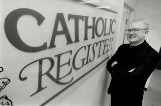 Rev. Carl Matthews, new Editor of the Catholic Register. (Shown) in their Bond St. Office