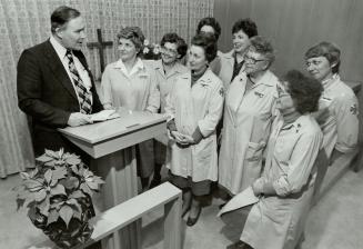 Executive meeting: Rev. Roger Maggs, chaplain of Oshawa General Hospital, talks to auxiliary officers in the chapel named for Adelaide McLaughlin, aux(...)