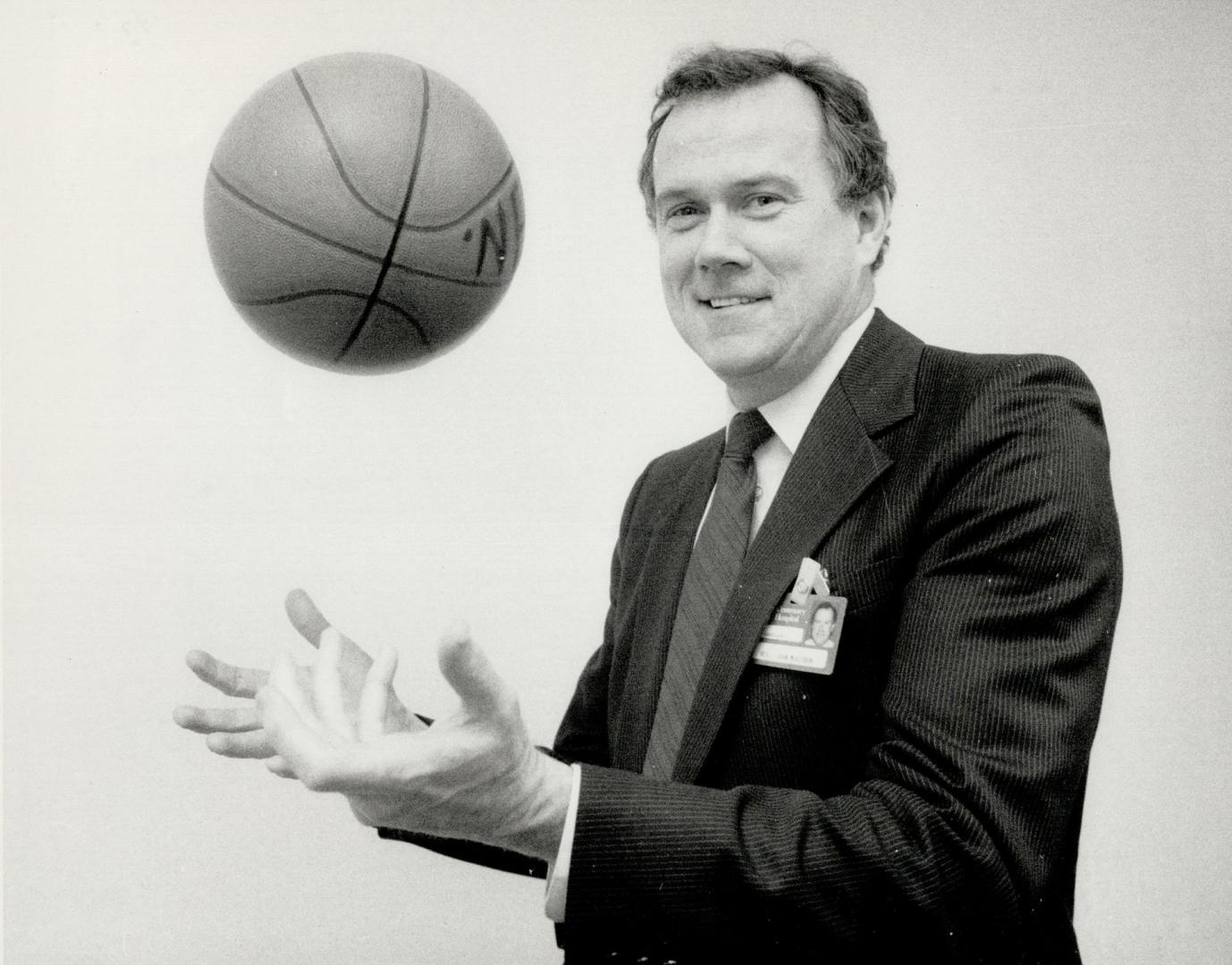 Athletic minister: Rev. John McKibbon, who recently became Centenary Hospital's first director of pastoral services, tosses a basketball in reverence (...)