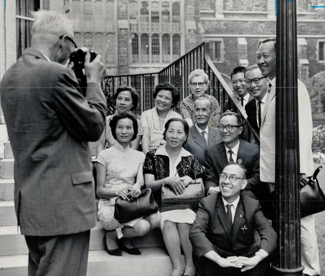 Presbyterian Church Moderator Dr. Hugh McMillan Turns camera to snap a picture of the Formosan Visitors
