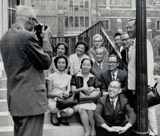 Presbyterian Church Moderator Dr. Hugh McMillan Turns camera to snap a picture of the Formosan Visitors