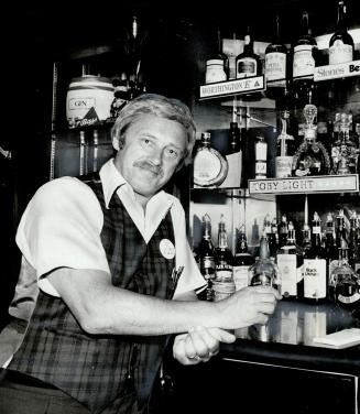 Bartender at the Hops and Grapes pub, 14 College St