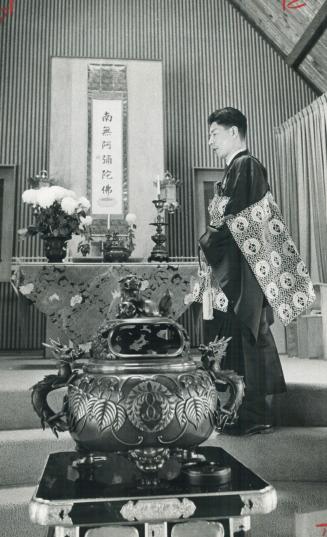 Rev. Fumimaro Watanabe conducts Buddhist service. Toronto church has 600 members, most Japanese-Canadians, others converts
