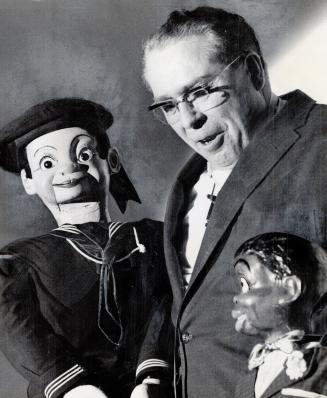 Rev. Frank Wellington with two talkative friends - Tiny and Chocolate, The children's Billy Graham' smuggles some painless religion into his bag of tricks