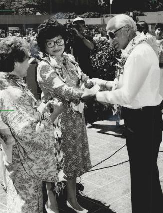 Touching moment: Michigan priest George Zabelka, a 30-year-old chaplain when the bomb dropped in 1945, exchanges greetings with Setsuko Thurlow, who was 13 and lucky to escape