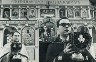 Rev. George Demopoulos and Rev. John Kourlour as conduct Greek liturgy in St. George's church